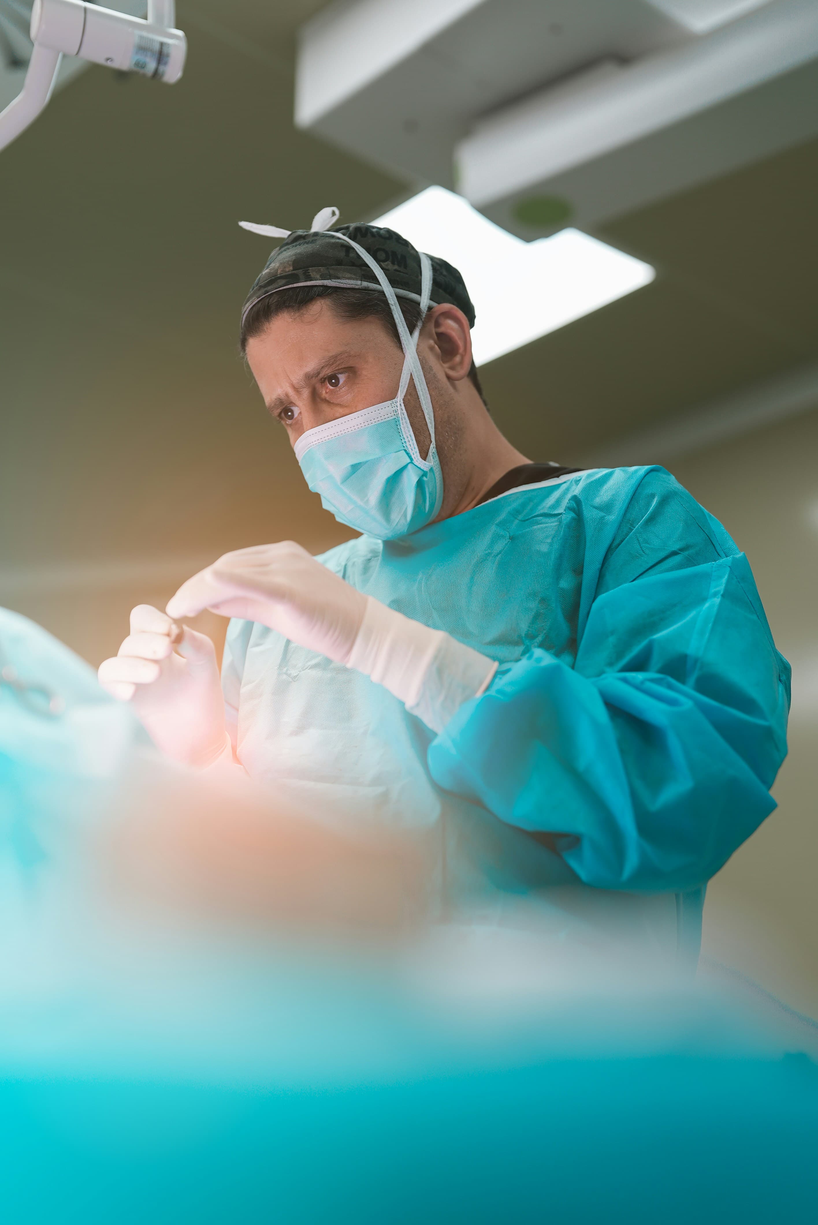 A consultant orthopaedic surgeon in theatre